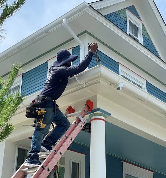 New gutter installation with downspout