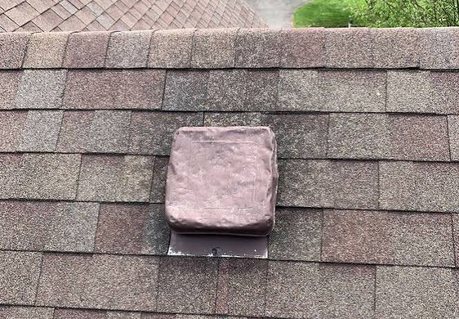 Storm damage on a roof turtle vent